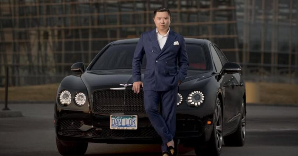 Dan Lok speaking at a professional event representing his high-ticket business brand